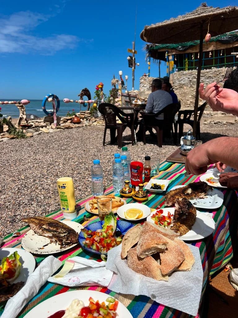 Grilled fish lunch by the Atlantic beach near Essaouira after a dunes ride
