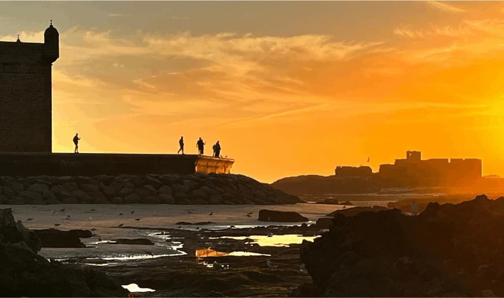 Essaouira Skala ramparts silhouette at sunset as the medina fades behind you