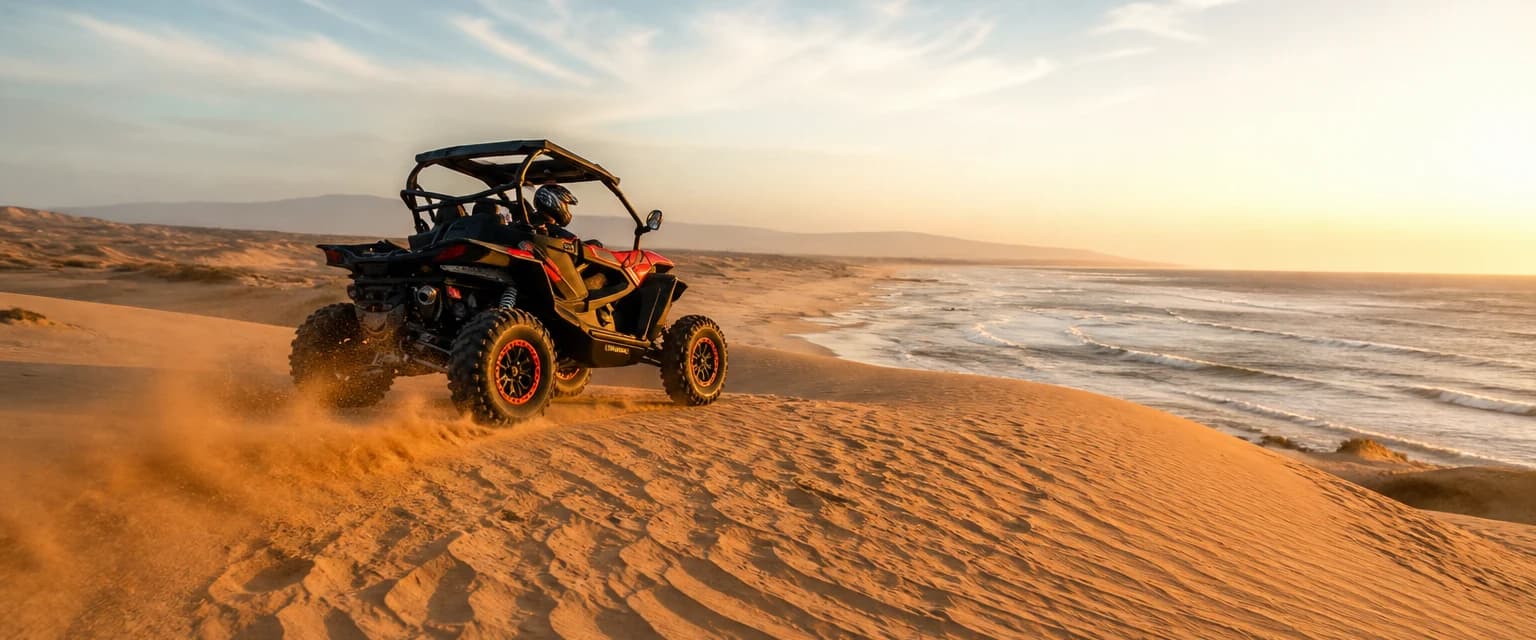 Buggy cresting Atlantic dunes as the Essaouira ride begins at golden hour